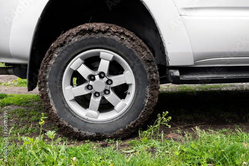 Mud tyre off road closeup background. Extreme sport concept. Road trip concept. Offroad car. © Adil