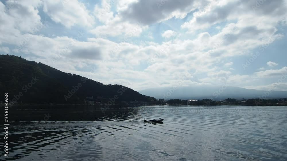 Moving boat in lake kawaguchiko. Concept for travel and natural in japan. Moving boat in lake kawaguchiko. Concept for travel and natural in japan.