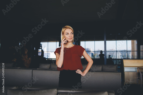 Fotografie Attractive female watching video or reading business weblog in network on cell t