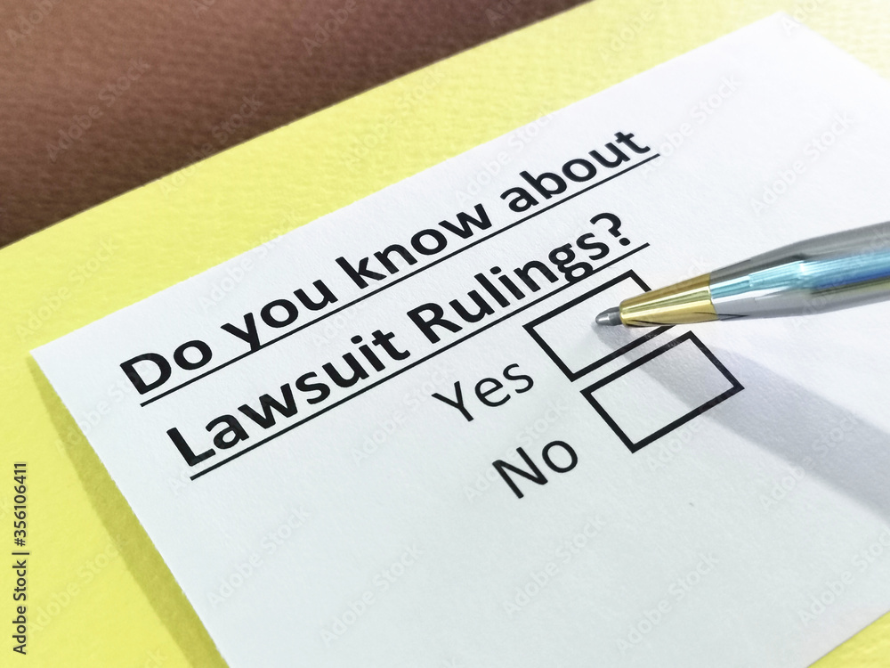 Obraz premium One person is answering question about lawsuit rulings.