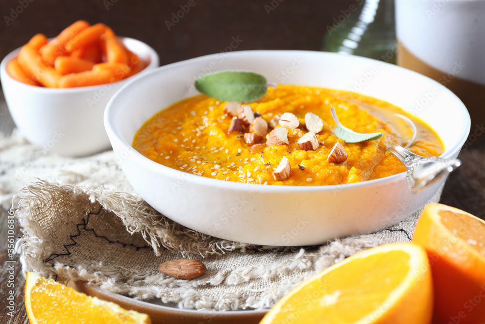 Vegetarian carrot soup with orange juice, sesame and almond nuts dressing Vegetarian carrot soup with orange juice, sesame and almond nuts dressing