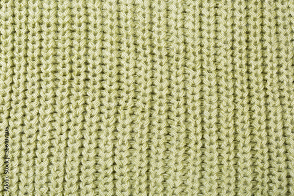 texture of woolen knitted fabric, vertical pattern, green color texture of woolen knitted fabric, vertical pattern, green color