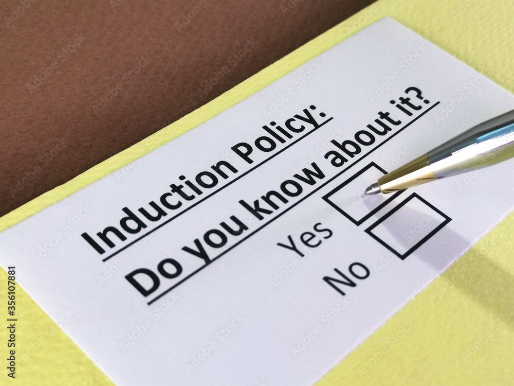 One person is answering question about induction policy. One person is answering question about induction policy.