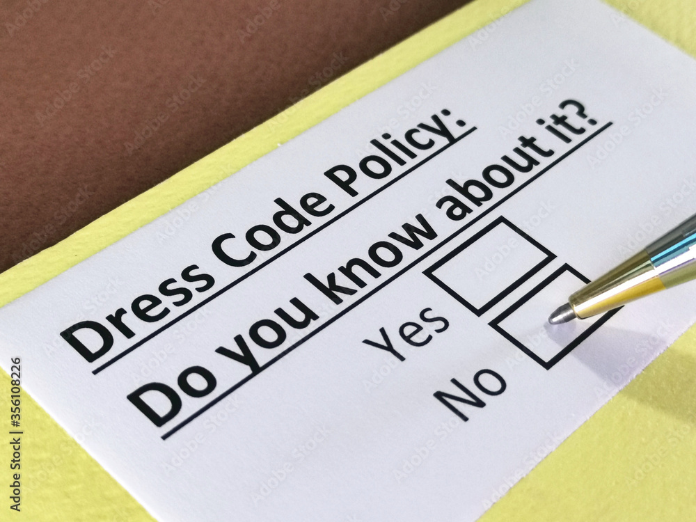 One person is answering question about dress code policy. One person is answering question about dress code policy.