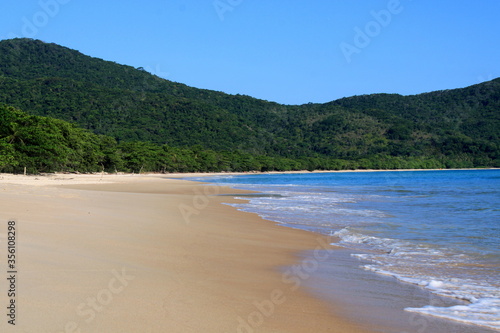 Beach with white sand blue water beautiful clean © Yana
