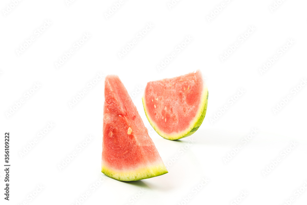 Seedless watermelon on a white background. two pieces of watermelon.