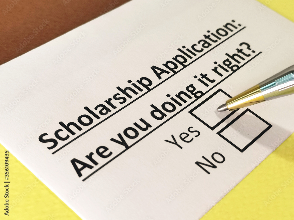 One person is answering question about scholarship application. One person is answering question about scholarship application.
