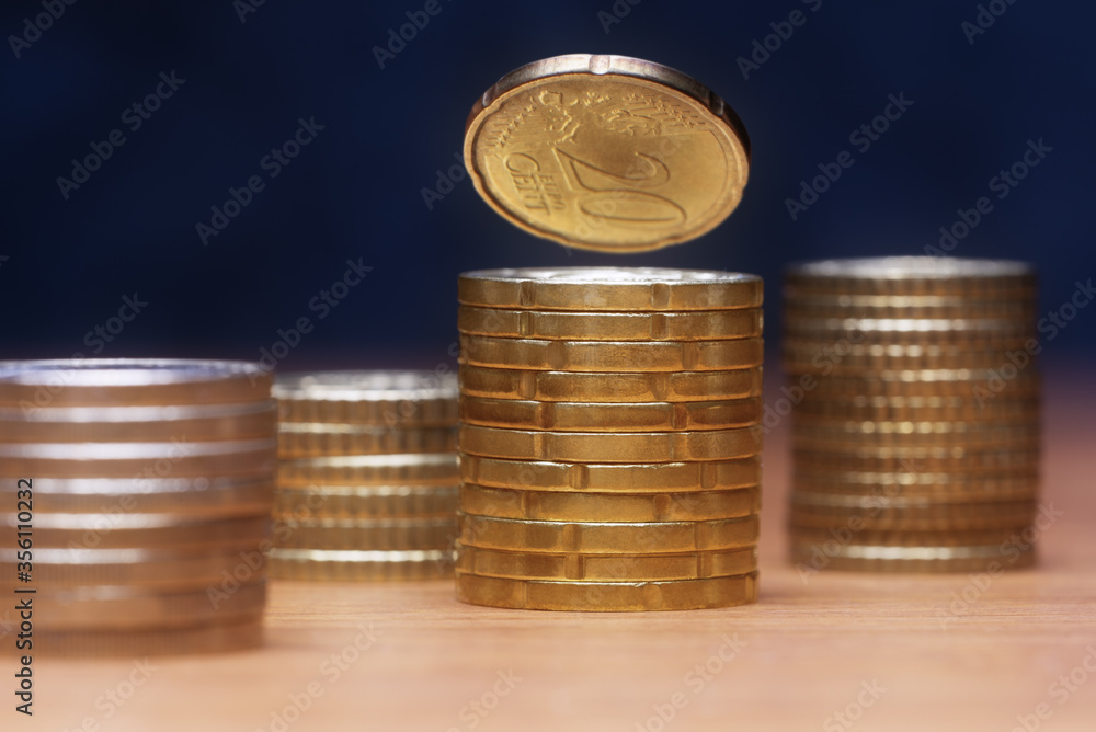 Euro coins columns, selective focus. Financial and business concept Euro coins columns, selective focus. Financial and business concept