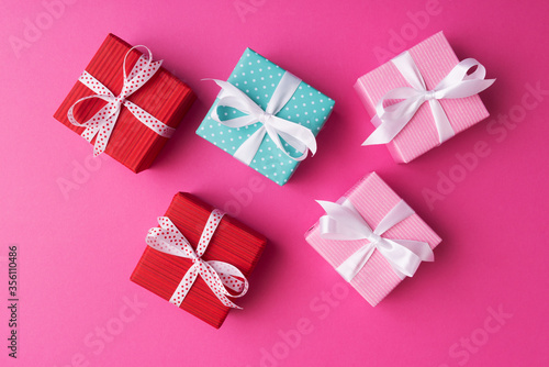 Gift boxes on pink background. Flat lay