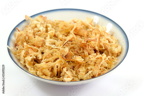 Dried shredded squid in a plate