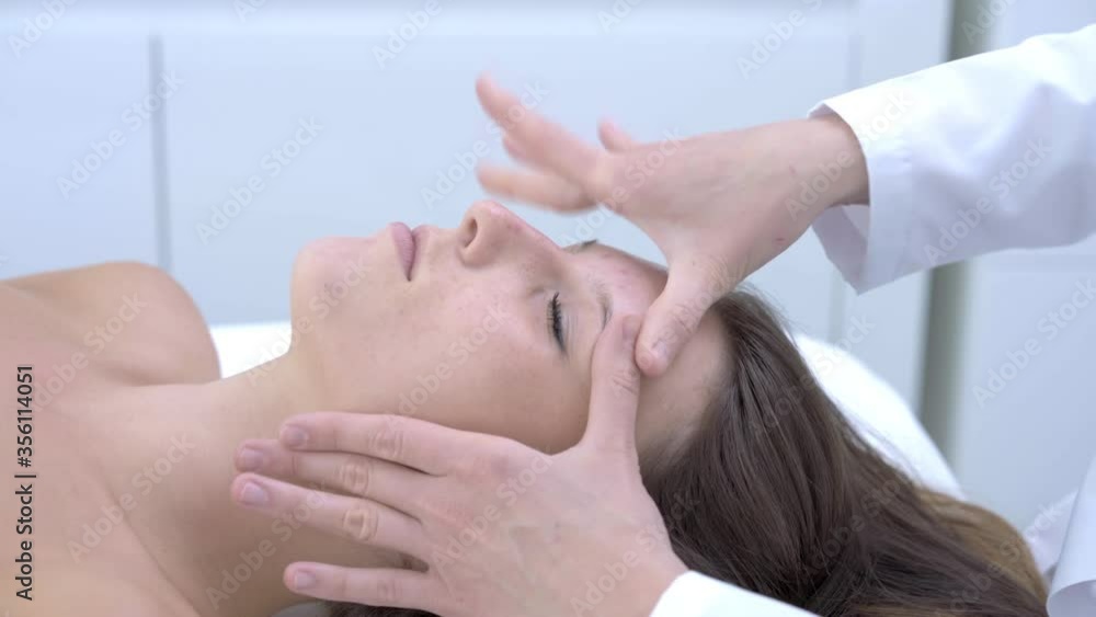 Close-up 4K video of woman enjoying japanese face massage in professional salon Close-up 4K video of woman enjoying japanese face massage in professional salon