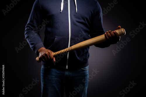 Cropped photo of afro american guy hold baseball beat ready fight for african people rights isolated over black color background