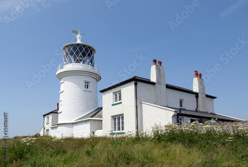 Caldey Lighthouse is located on the south end of Caldey Island, three miles off the south Pembrokeshire coastline. It was built in 1829, guiding shipping past St Gowan Shoals and Helwick Sands. photo