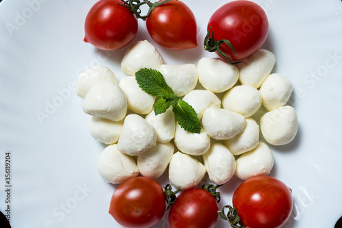 Mini balls of mozzarella cheese and cherry tomatoes
