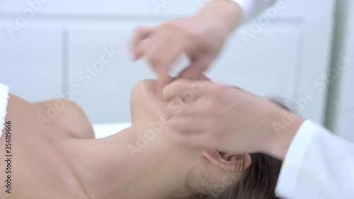 Close-up 4K video of woman enjoying japanese face massage in professional salon
