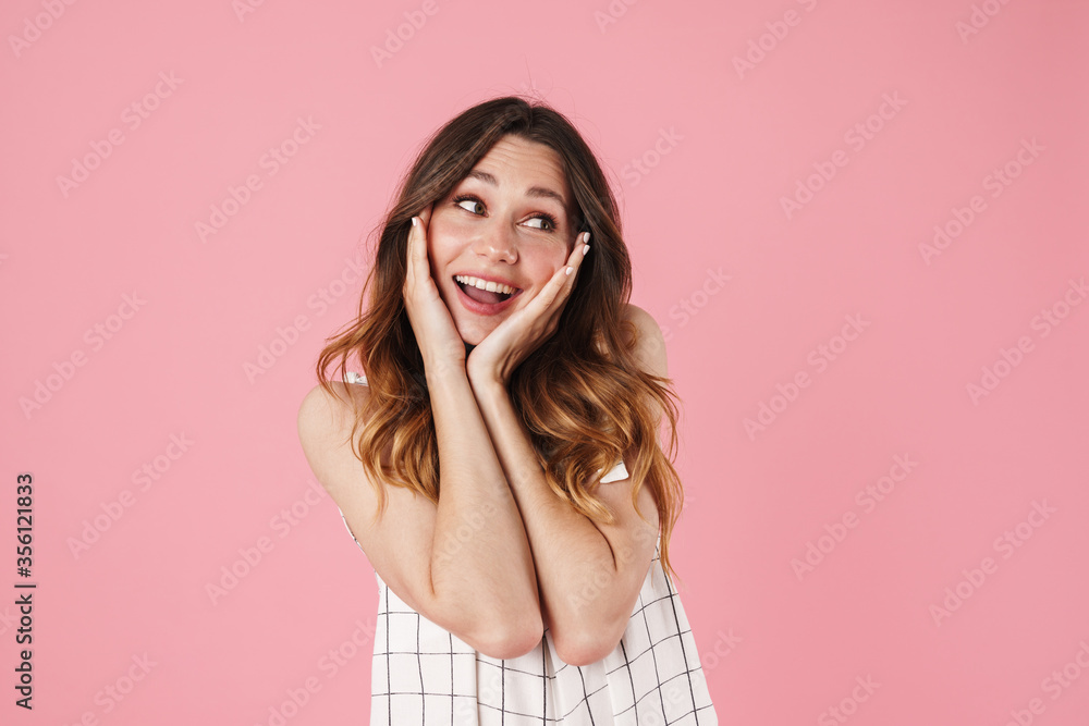 Image of happy beautiful woman smiling and looking aside Image of happy beautiful woman smiling and looking aside