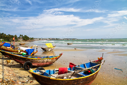 Traditional fishing boats in Mui Ne fishing village, Vietnam photo