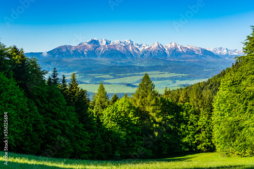 Beautiful spring view of the mountains. The highest peaks and slopes are still covered with snow.