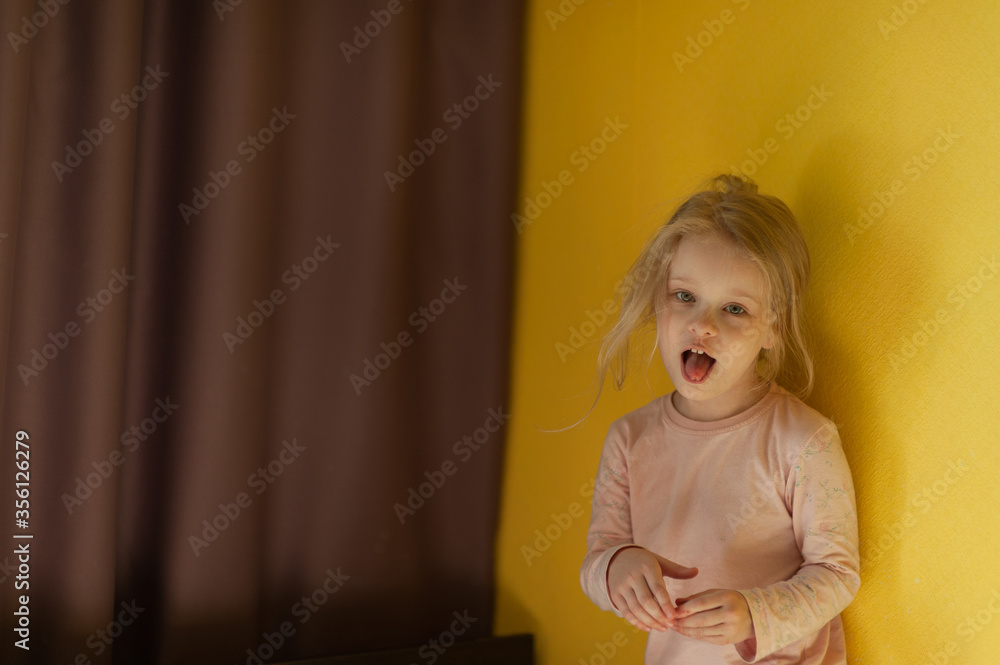 Portrait of a little girl at home. Disheveled little girl at home. Portrait of a little girl at home. Disheveled little girl at home.