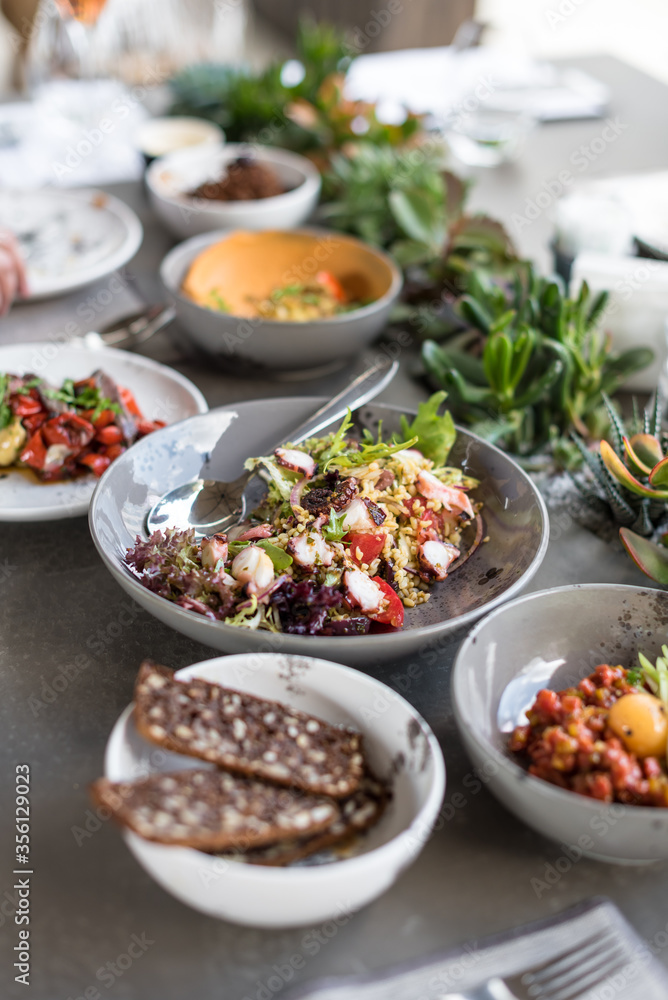 Summer Lunch with Mediterranean Salads and Appetizers. Dinner Table