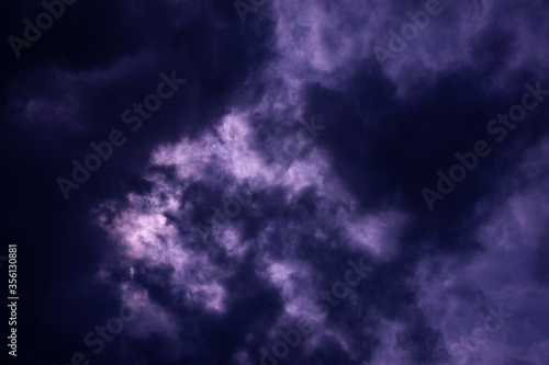 Natural sky composition. Dark ominous blue storm rain clouds. Dramatic sky. Overcast stormy cloudscape. Thunderstorm. Element of apocalypse design.