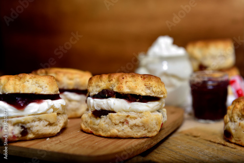 Homemade Scones with cream and marmalade photo