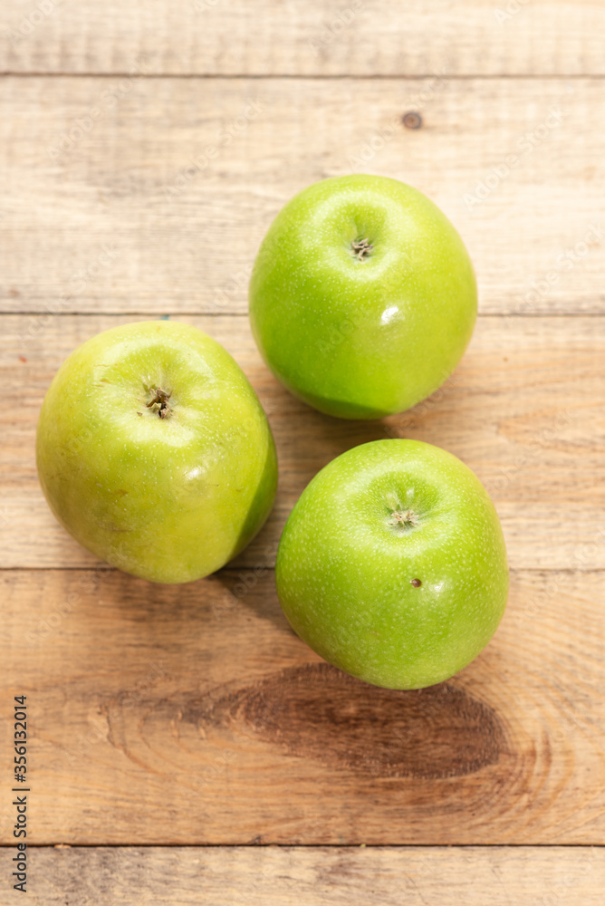 Ripe tasty apples on a wooden table. Healthy food Ripe tasty apples on a wooden table. Healthy food