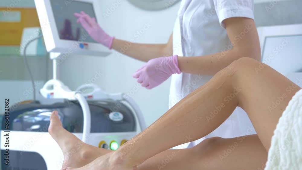 Close-up 4K video of adult woman receiving laser hair removal Close-up 4K video of adult woman receiving laser hair removal
