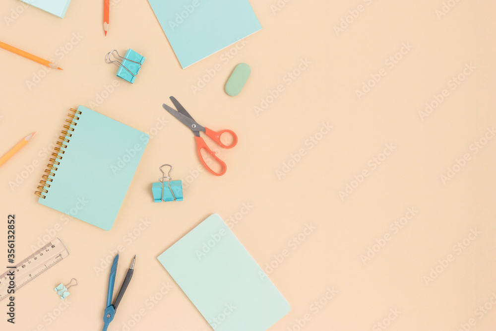 Top view of various stationery on a beige background. Back to school concept with copy space. Top view of various stationery on a beige background. Back to school concept with copy space.