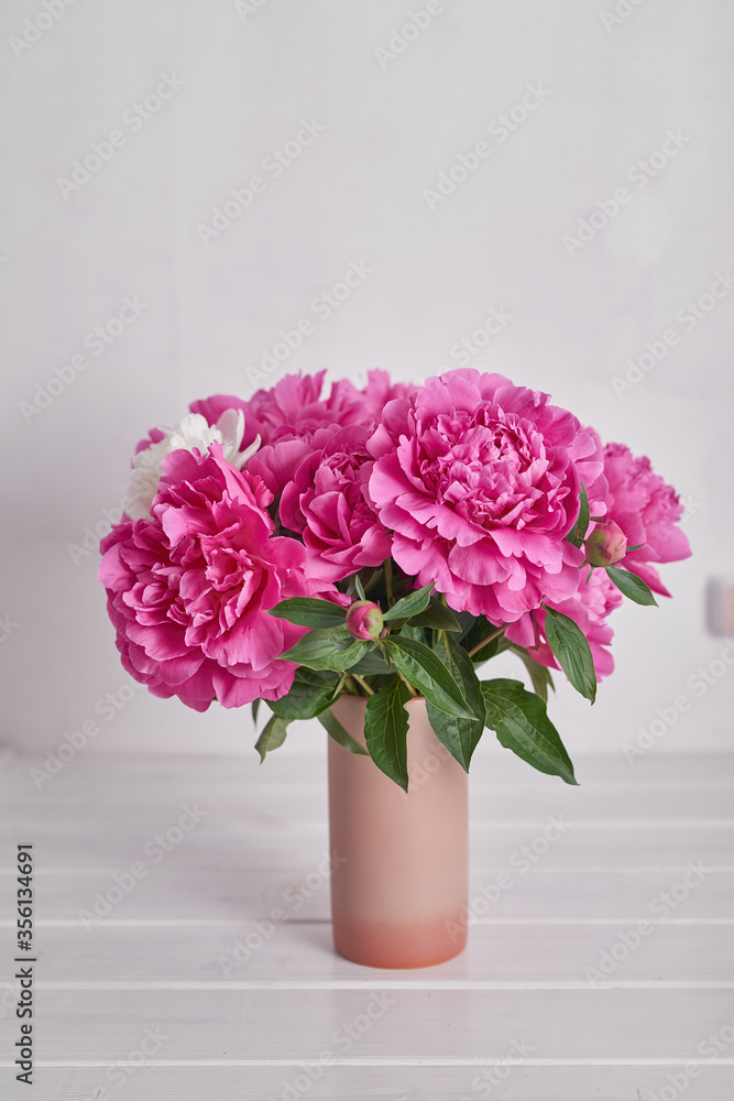 Peony bouquet in vase. Rich bunch of peonies. Greeting card for mother's day. Women's Day. Valentine's Day. Copy space. Spring or summer greeting card with flowers.Wedding invitation.Happy Birthday Peony bouquet in vase. Rich bunch of peonies. Greeting card for mother's day. Women's Day. Valentine's Day. Copy space. Spring or summer greeting card with flowers.Wedding invitation.Happy Birthday