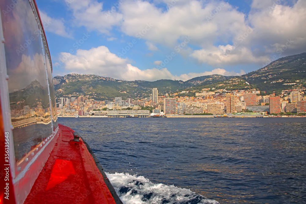 Φωτογραφία View from the Mediterranean sea of the Principality of Monaco, and Monte Carlo, with dense skyscrapers, the marina, palace & casino