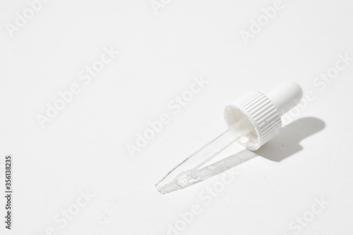 a broken of bottle with dropper on white background. 