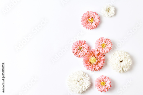 frame autumn flowers. pink stars on a white background. space for text, flat layout