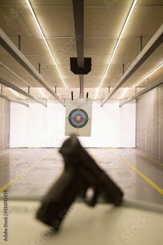 indoor gun shooting of target range. photo