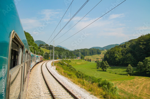 View out of the window of a train in Slovenia photo