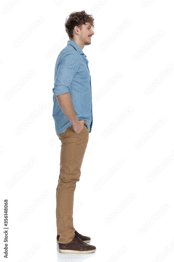 smiling young casual model waiting in line smiling young casual model waiting in line