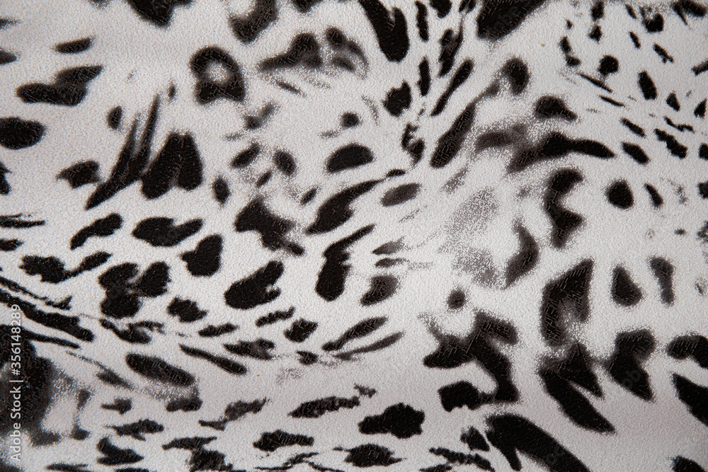 Black and white abstract camouflage. The concealment pattern on a fabric. Concept of winter masking. Black and white abstract camouflage. The concealment pattern on a fabric. Concept of winter masking.