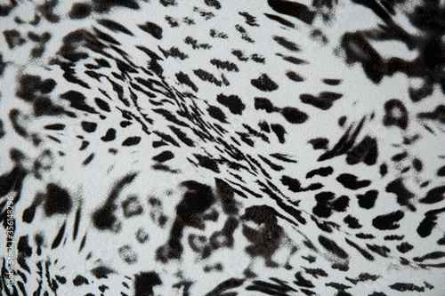 Black and white abstract camouflage. The concealment pattern on a fabric. Concept of winter masking.