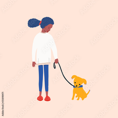 African american girl volunteering in animal shelter walking little puppy.