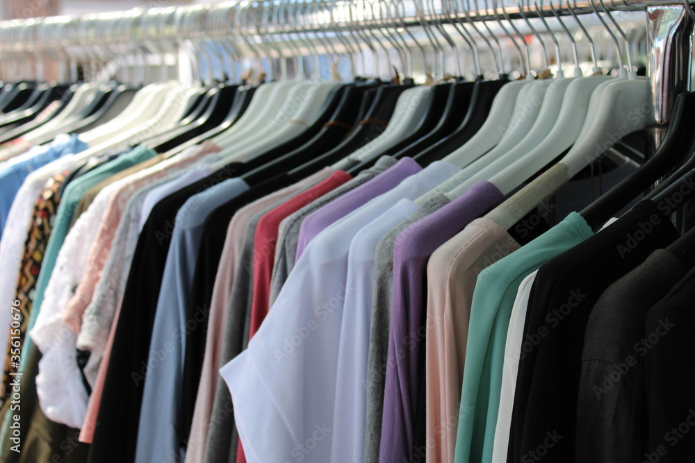 colorful cotton clothes hanging on hangers