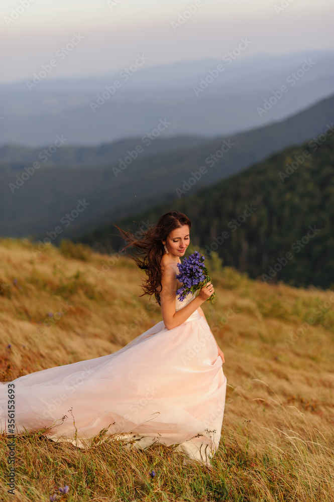 Portrait of a beautiful bride with a bouquet of wildflowers Portrait of a beautiful bride with a bouquet of wildflowers
