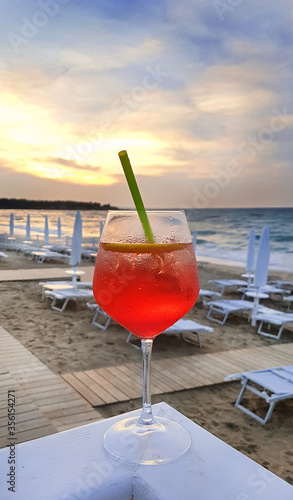Cocktail Aperol Spritz on the background of evening beach