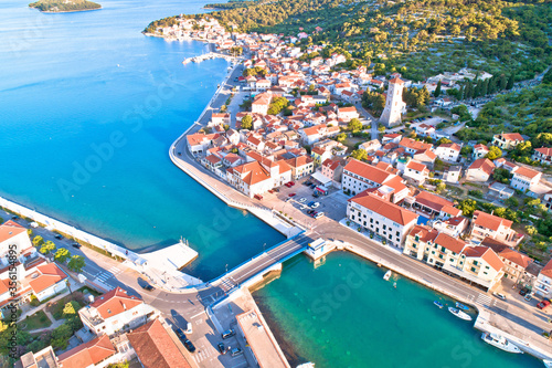 Coastal town of Tisno aerial panoramic view, bridge to island of Murter © xbrchx
