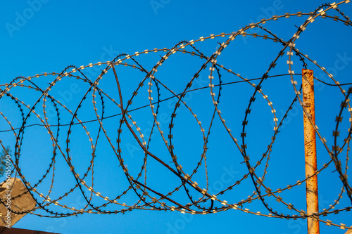 barbed wire against the sky