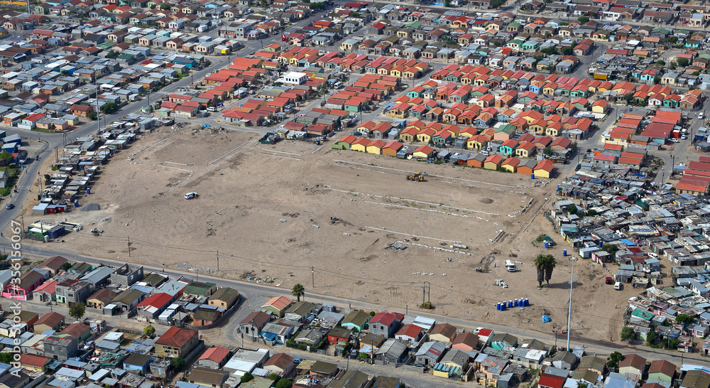 Cape Town, Western Cape / South Africa - 01/29/2014: Aerial photo of RDP housing project and surrounding shacks