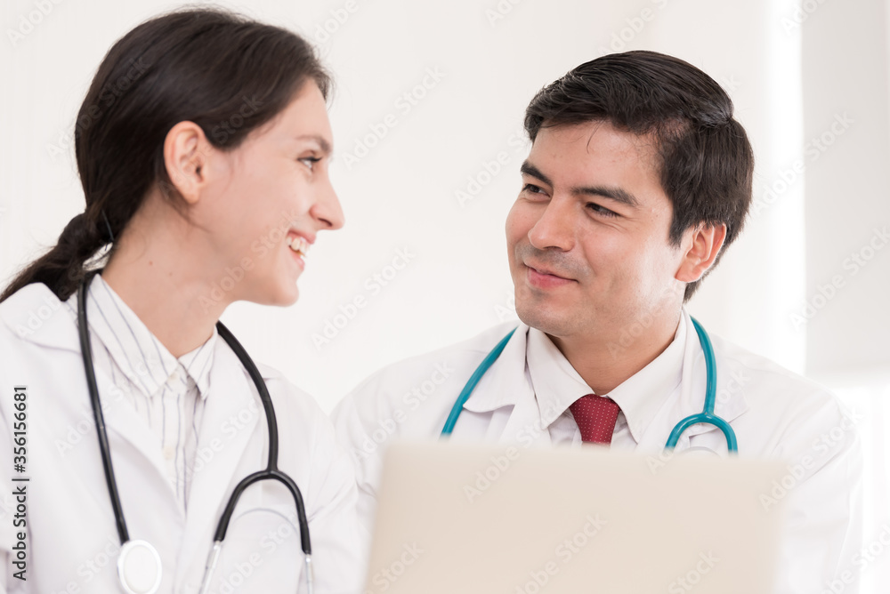 Two doctors have working together with happiness in the hospital. Two doctors have working together with happiness in the hospital.