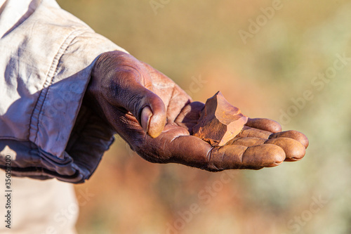 Traditional owner holding artefact