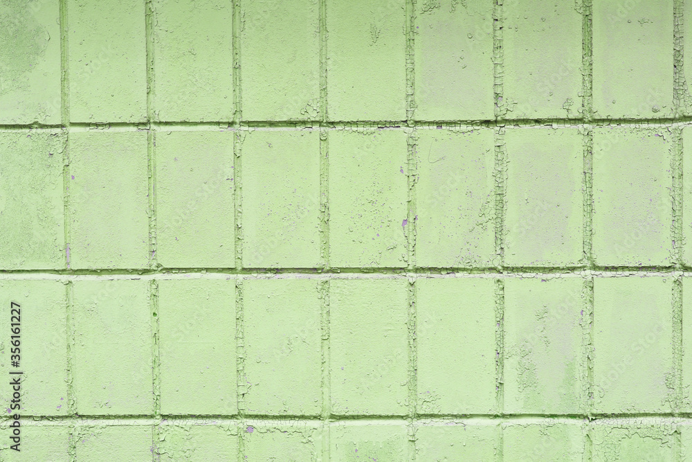 Naklejka premium Beautiful vintage green background with old green paint with a rough surface, streaks and uneven texture of green paint on an old rough surface