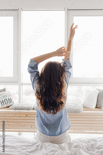 Fotografie Female hands on a background of a window