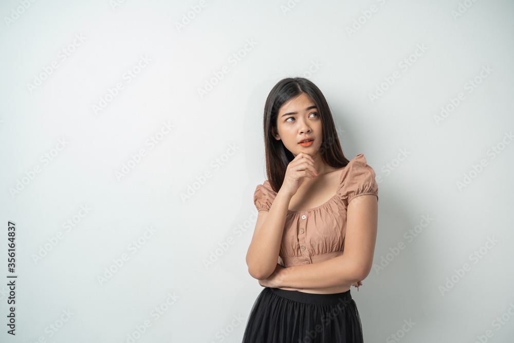 beautiful girl with long hair stood up while looking surprised with an isolated background beautiful girl with long hair stood up while looking surprised with an isolated background